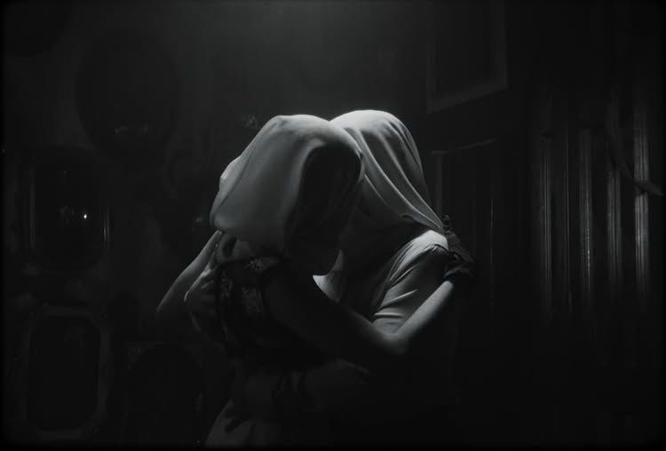 Dramatic black and white scene with fabric