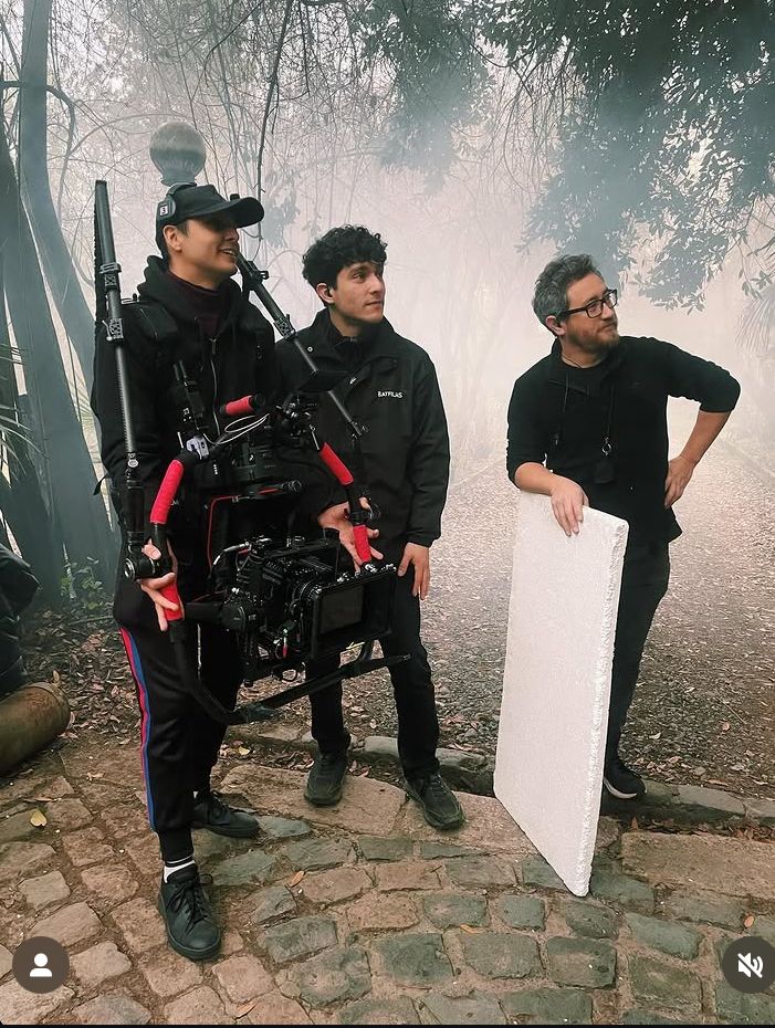 Crew on foggy set with camera equipment